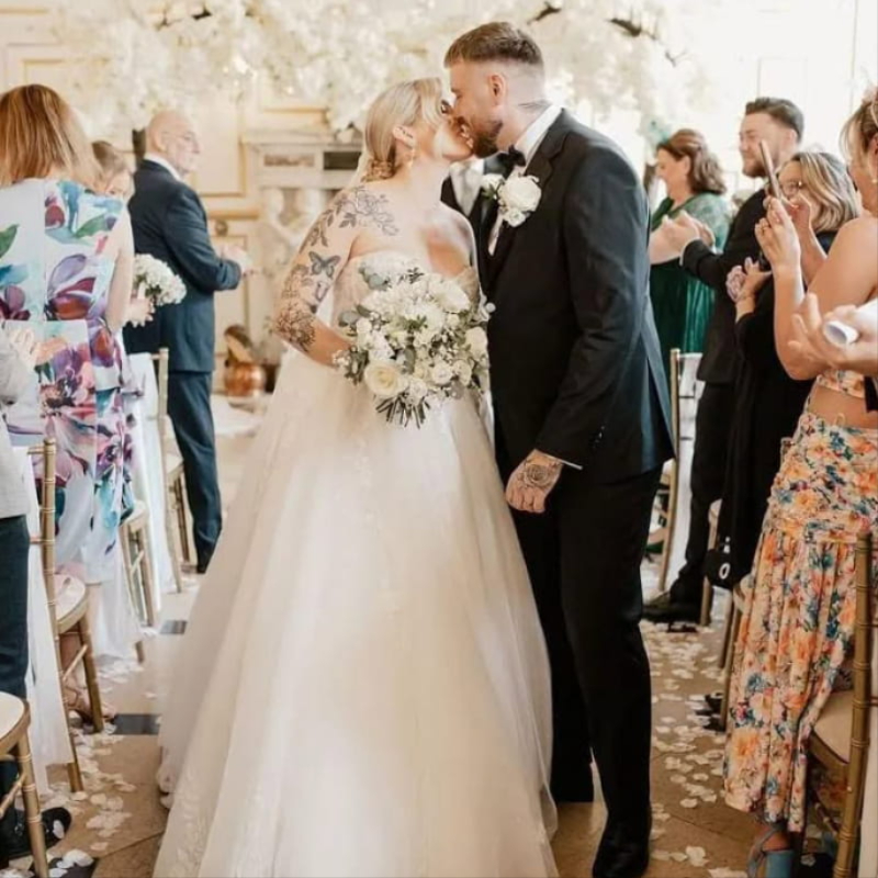 Bride with wedding flowers by B's Blooms in Tiptree, Essex
