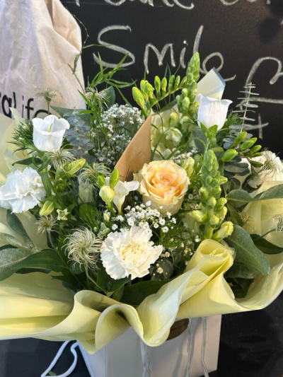 Woodland Grace - A hand-tied bouquet of fresh seasonal flowers in soft white, cream and green tones, with flowers dependent on seasonal availability.