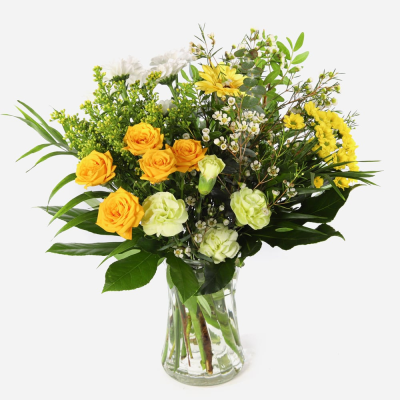 Sunshine Harmony Vase - A cheerful vase arrangement featuring fresh seasonal flowers in vibrant yellow, pink and cream tones, with flowers dependent on seasonal availability.