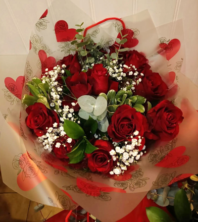 Endless Love - A classic bouquet of rich red roses, beautifully complemented by delicate white accents and fresh greenery.